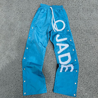 comprare Pantaloni da ginnastica in nylon per uomo su misura con vita elastica e stampa riflettente online manufacture